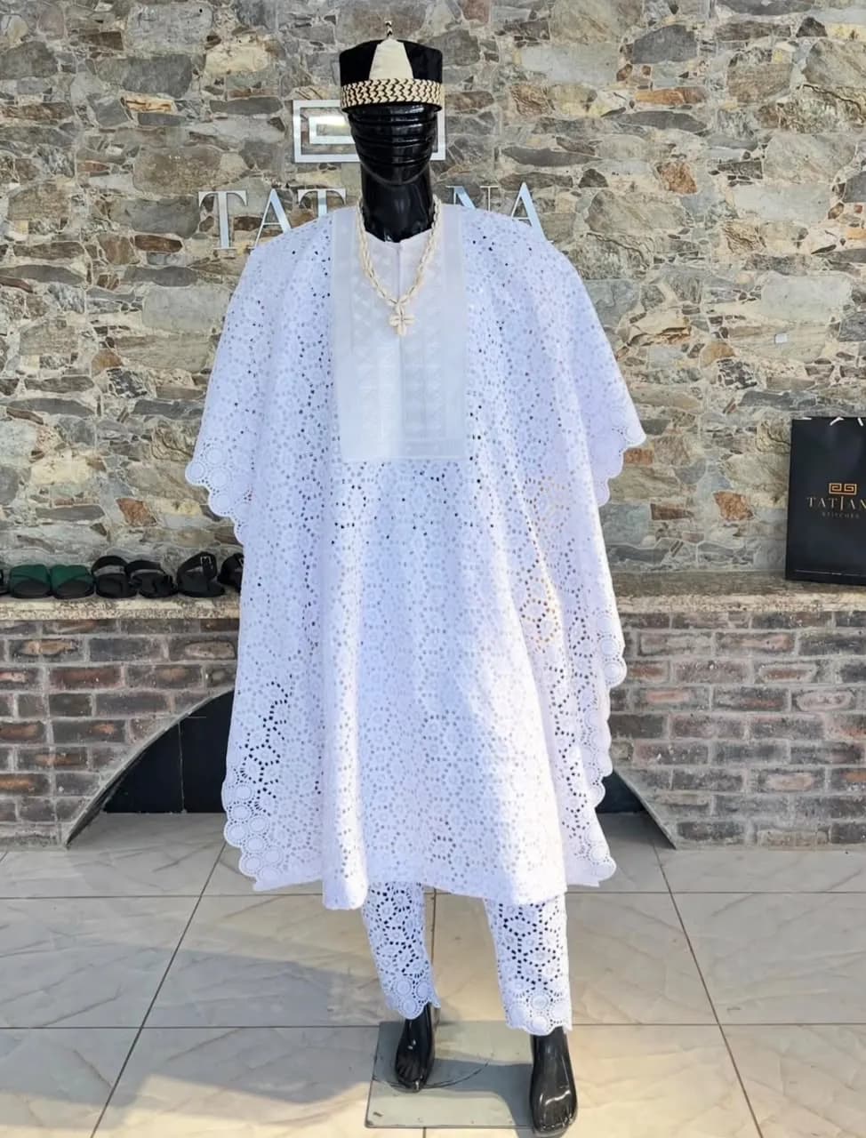 White lace agbada on a mannequin